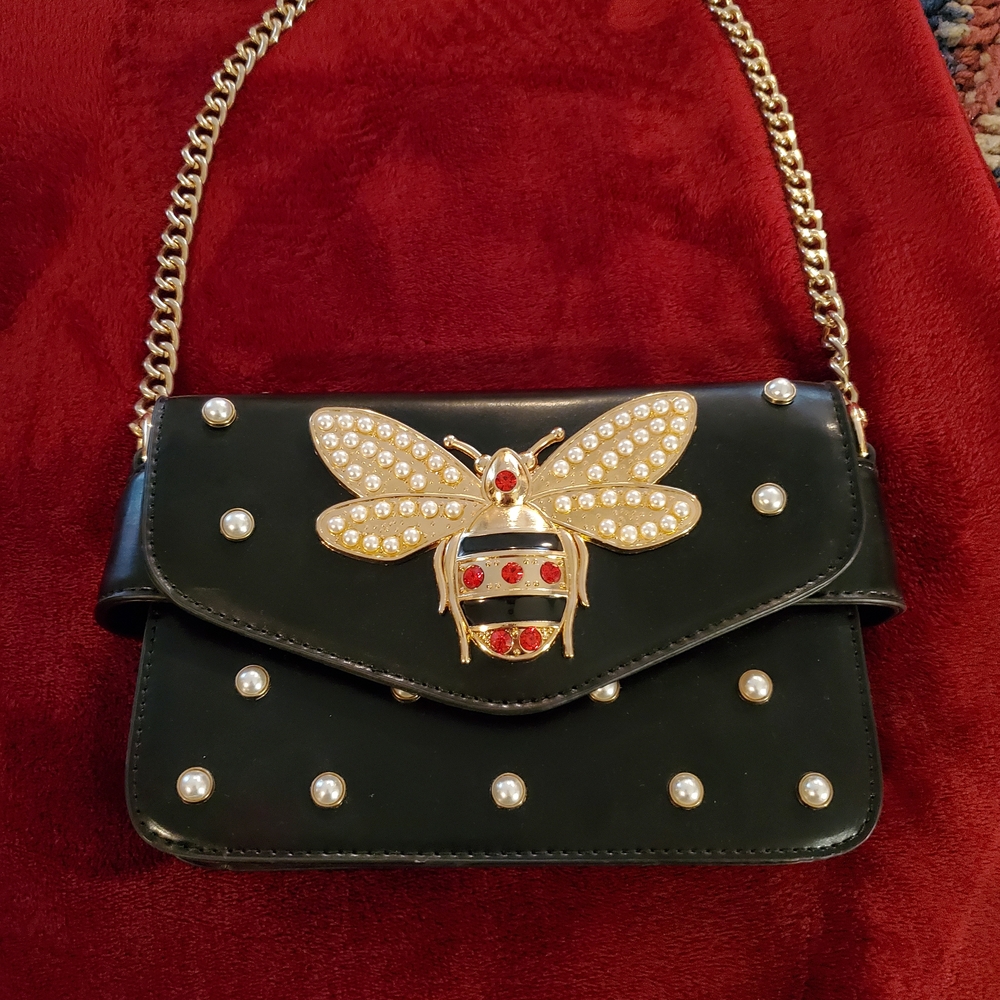 Elegant Black Handbag with Gold Chain and Embellishments